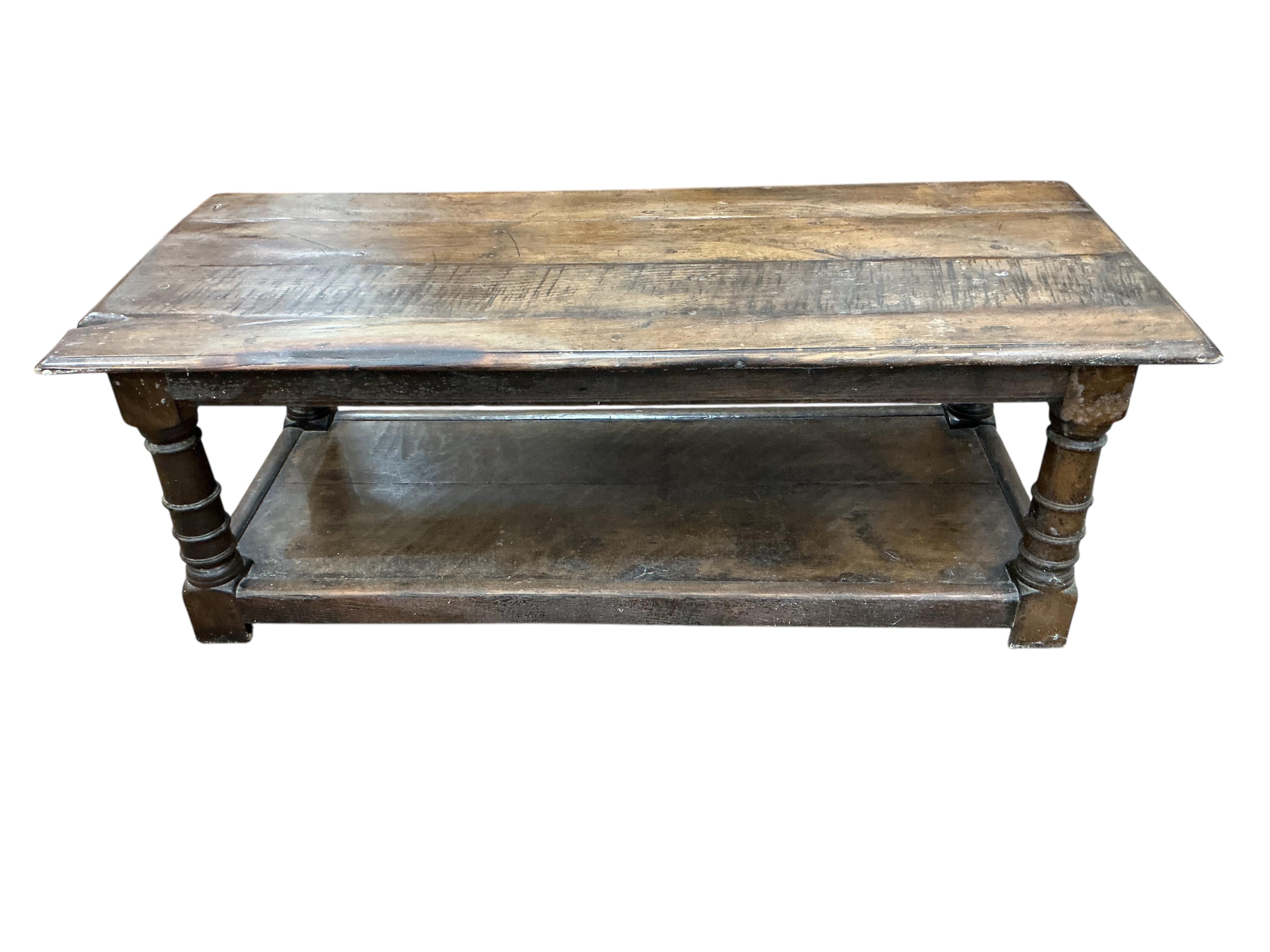 An 18th century style rectangular oak two tier coffee table, width 122cm, depth 50cm, height 43cm